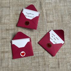 three red envelopes with magnets on them