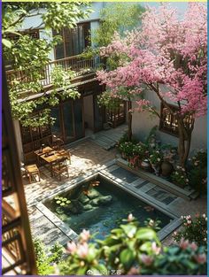 an aerial view of a courtyard with a pond and patio furniture in the foreground