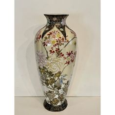 a large vase with flowers painted on it