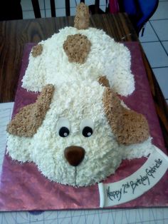 a cake shaped like a dog on top of a table