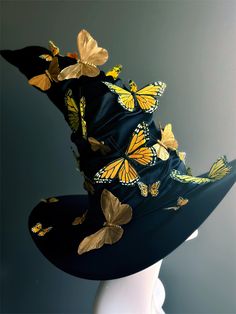 a black hat with yellow butterflies on it