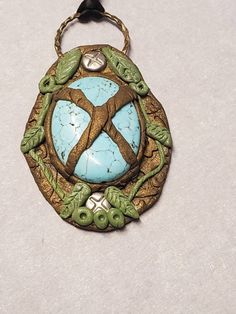 "Nature has taken ahold of this beautiful turquoise cabochon.  Perfect for green witch, warlock, tailsman, hobo, hippie, pagan Pendant measures 3\" tall x 2\" wide Signed on the back" Artisan Green Turquoise Necklace With Large Pendant, Bohemian Green Oval Turquoise Necklace, Handmade Green Turquoise Bohemian Necklace, Unique Green Turquoise Collectible Necklace, Handmade Bohemian Green Turquoise Necklace, Bohemian Green Handmade Turquoise Necklace, Unique Green Oval Turquoise Necklace, Artisan Green Turquoise Necklace With Patina, Bohemian Green Turquoise Necklace With Large Pendant