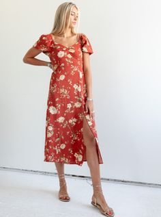 The Janie Floral Dress is a fun fall dress that is perfect for a special occasion or an evening out. Featuring gentle puff sleeves, a structured bodice with seam detailing, and smocking at the back for added comfort. Fit: True to sizeFabric Content: 100% PolyesterFabric Care: Machine Wash Cold Gentle Cycle, lay flat to dryMeasurements: 49" Shoulder to hemLining: Yes 100% PolyesterZipper: No S:0-2 M:4-6 L:8-10 Fitted V-neck Dress With Gathered Neckline, Floral Print Puff Sleeve Dress With Fitted Bodice, Puff Sleeve Dress With Floral Print And Fitted Bodice, Spring Floral Print Puff Sleeve Dress With Fitted Bodice, Fitted Floral Print Puff Sleeve Dress Down, Fitted Floral Print Puff Sleeve Dress For Casual Occasions, Puff Sleeve Dress With Floral Print For Garden Party, Fitted Square Neck Maxi Dress For Casual Wear, Garden Party Puff Sleeve Floral Dress With Fitted Bodice