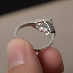 This is a gorgeous handmade creation. Its beauty is its simplicity & Elegance. The 6*6 mm heart cut faceted natural Aquamarine is crafted in solid sterling silver and with rhodium plated. All item is sent in a beautiful gift box If you have any idea of design your ring,pls contact me directly. You can realize more lovely stuff clicking the link https://www.etsy.com/shop/knightjewelry?refshopsection_shophome_leftnav Please leave the correct address and you phone number for delivering successf Moissanite Heart Ring With Round Cut For Gifting, Moissanite Heart Ring With Center Stone For Promise, Moissanite Heart Ring For Promise, Heart-shaped Moissanite Promise Ring, Moissanite Heart Promise Ring, Moissanite Heart Cut Ring With Halo Setting, Heart Cut Moissanite Ring With Halo Setting, Fine Jewelry Moissanite Heart Promise Ring, Moissanite Heart Ring With Prong Setting As Gift