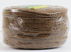 a bag of brown stuff sitting on top of a white table