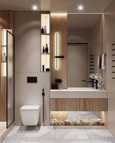 a modern bathroom with a toilet, sink and shower stall in it's center