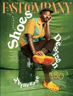 a man sitting on top of a green chair holding a yellow and orange sneaker