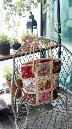 a purse sitting on top of a metal chair