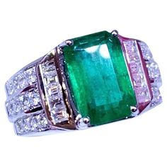 An exclusive ring in delicate and elegant design, so beauty , sophisticated. Adds a touch of class and grace on your look. Stunning ring come in 18k gold with a Natural Zambian Emerald , fine quality, spectacular color , of 4,00 carat, and 34 pieces of Natural Diamonds of 1,48 carats, F color VS clarity, very sparkly. Handcrafted by artisan goldsmith. Excellent manufacture and quality of stones. Complete with AIG report. Wholesale Price. Extremely high end product. Shop with Confidence. We offer Luxury Exquisite Emerald Ring, Emerald Ring 1stdibs, Luxury Faceted Emerald Rings, Luxury Polished Emerald Ring Collectible, Luxury Emerald Cabochon Rings, High End Products, Zambian Emerald, 18k Gold Ring, Zambia