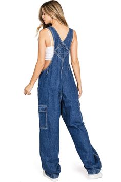 Classic twill canvas overalls with baggy?straight leg?fit, cargo pockets and a cuffed hem. Traditional style bib with pockets on the chest?and to the sides and button up closures on the sides. Try it paired with a crop top or layer a long sleeve tee underneath! CARE | Hand Wash or Machine Wash Cold CONTENTS | 100% Cotton?MEASUREMENTS | 56"/142 cm Top to Bottom 29"/74 cm Inseam (Size Small) MODEL | 5'8 - wearing a size SmallIMPORTED Cheap Denim Bib Front Bottoms, Utility Style Cotton Jumpsuits And Rompers With Cargo Details, Utility Cotton Jumpsuits And Rompers In Cargo Style, Utility Cotton Cargo Jumpsuits And Rompers, Utility Cotton Overalls With Pockets, Utility Overalls With Side Pockets And Bib Front, Cotton Overalls With Pockets For Fall, Casual Cotton Overalls With Patch Pockets, Utility Cotton Jumpsuits And Rompers With Multiple Pockets