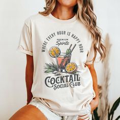 Thank you for visiting SuniDazeDesigns and supporting a family owned business.  Raise your glass and join the fun with our "Cocktail Social Club" graphic shirt! Perfect for beach days and summer nights, this shirt features a vibrant design that celebrates good times and great cocktails. Made from ultra-soft fabric for ultimate comfort, it's your go-to tee for mixing, mingling, and making memories under the sun. Cheers to style and good vibes! Please carefully read the following... HOW TO ORDER  Choose Your Size Choose Your Shirt Color Select the quantity Click Add To Cart For multiple items go back to the listing and repeat the steps. PLEASE MAKE SURE YOU HAVE READ AND UNDERSTAND THE DESCRIPTION FULLY BEFORE PLACING AN ORDER  🎨 PRINTING Direct-to-garment print: design can appear less vibr Luxury Chic T-shirt For Summer, Luxury Graphic Print T-shirt, Luxury Summer Party Shirt, Luxury Designer Shirt With Graphic Print, Trendy Cheap T-shirt For Club, Luxury Screen Print T-shirt For Summer, Luxury T-shirt For Summer, Luxury Graphic Print Shirt, Luxury Classic T-shirt For Summer