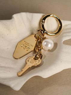 Composition : Brass, acrylic pearlColor : Gold,WhiteCountry of Origin : KOREA House Keys Keychain, Key Ring Gucci, Stanley Accessories Aesthetic, Christmas Wishlist Ideas 2024, Keychain Inspo Aesthetic, Gold Keychain, Key Charms, Keychain Aesthetic Ideas, Keys Aesthetic