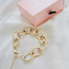 This link bracelet is a versatile chunky classy piece that goes with any look. Wear it with another bracelets to create an arm party. You can also linked this bracelet with another bracelet to wear them as a choker or link this bracelet with a choker for a longer length. Bracelet Details: Material: 18K Gold Plated & Stainless Steel Length: 7' Inch and you can add 2 inches with the extender Thickness: 12mm Quantity: 1 Color: Gold Does not tarnish/change color overtime Water Resistant Check Our Je Modern Chunky Chain Link Bracelets, Chic Metal Bracelet Jewelry, Chic Adjustable Bracelets, Chic Bangle Charm Bracelet Gift, Metal Link Jewelry For Parties, Trendy Gold Jubilee Bracelet, Chic Metal Paperclip Chain Bracelet, Chic Metal Paperclip Bracelet, Chic Adjustable Chain Bracelet With Rectangular Links