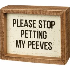 a wooden box sign that says, please stop petting my pees