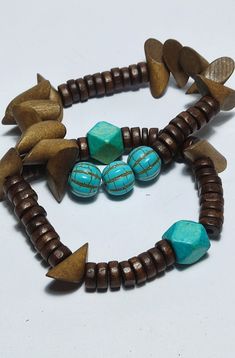 Unique wooden beads bracelets, set of two. Made with beautiful wooden beads and turquoise beads, these bracelets are great for you or as a gift to your loved ones. These bracelets are made to fit any wrist. Wooden Beaded Bracelets, Wood Bracelet, Beads Bracelets, Bracelets Set, Bead Leather, Nature Bracelets, Boho Bracelets, Turquoise Beads, Wooden Beads