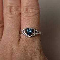 This is a gorgeous handmade creation. Its beauty is its simplicity & Elegance. The 6*6 mm heart cut faceted real London blue topaz is crafted in solid sterling silver and with rhodium plated. All item is sent in a beautiful gift box If you have any idea of design your ring,pls contact me directly. You can realize more lovely stuff clicking the link https://www.etsy.com/shop/knightjewelry?refshopsection_shophome_leftnav Please leave the correct address and you phone number for delivering succ Sterling Silver Diamond Cut Topaz Promise Ring, Sterling Silver Diamond Cut Topaz Ring For Promise, Sterling Silver Sapphire Topaz Ring With Diamond Cut, Sapphire Topaz Ring With Diamond Cut In Sterling Silver, Topaz Birthstone Ring With Brilliant Cut For Gift, Heart-shaped Blue Topaz Birthstone Jewelry, Sterling Silver Heart Ring With Gemstone For Promise, Heart Cut Blue Topaz Ring As A Gift, Heart Cut Blue Topaz Ring For Gift