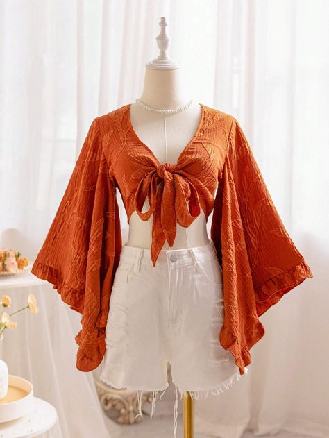 SHEIN WYWH Women's Brown Willow Texture V-Neck Tie-Front Blouse With Flared Sleeves And Ruffled Cuffs, Suitable For Vacation And Music FestivalsI discovered amazing products on SHEIN.com, come check them out! Bell Sleeve Top Outfit 70s, Pirate Shirts For Women, Open Back Shirts For Women, Boho Styles For Women, Flare Sleeves Blouse, Orange Bell Sleeve Top, Esentric Fashion Women, 70s Wrap Top, Hippy Clothes For Women