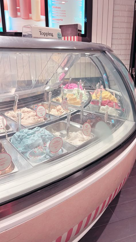 Pastel ice cream parlour with many flavours of ice cream in a glass case Pastel Ice Cream Aesthetic, Japan Ice Cream Shop, Ice Cream Parlour Aesthetic, Old Fashion Ice Cream Shop, Cute Shop Aesthetic, I’ve Cream Shop, Ice Cream Shop Background, Pink Ice Cream Aesthetic, Ice Cream Store Aesthetic