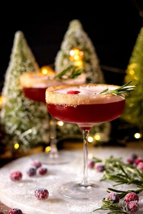 Festive and refreshing! Spiced rum mingles with cranberry, orange liqueur, and an infused maple simple syrup for a cozy and crisp winter cocktail. Spiced Simple Syrup Cocktails, Cocktails With Cranberries, Christmas Cocktail Presentation, Thanksgiving Cranberry Cocktail Recipes, Best Holiday Cocktail Recipes, Cozy Christmas Cocktails, Nuts And Berries Cocktail, Rum Rum Rudolph, Glitter Christmas Cocktails