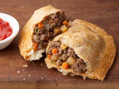 Meat Pie Recipes from Across the Country | Devour The Blog: Cooking Channel's Recipe and Food Blog Meat Hand Pie Recipe, Pasties Recipes, Hand Pie Recipes, State Foods, Hand Pie, Meat Pie, Hand Pies, Cooking Channel, Beef Dishes