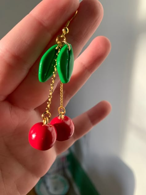 red clay balls on chains, connecting to oval shaped leaves to mimic cherries Polymer Clay Charm Earrings, Cherry Polymer Clay, Polymer Clay Cherry Earrings, Clay Cherry Earrings, Cherry Clay Art, 3d Polymer Clay Earrings, Fruit Earrings Polymer Clay, Diy Cherry Earrings, Cute Clay Earrings Ideas