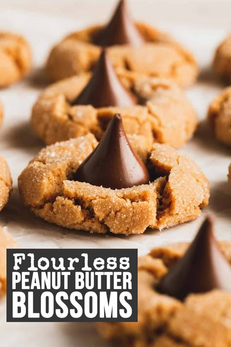 Flourless peanut butter blossoms are the new gluten-free twist on these classic Christmas cookies! This cookie recipe is so easy to make with only a handful of ingredients. Everyone loves this chewy peanut butter cookie with a Hershey's Kiss on top. Since it's flourless, this recipe is gluten-free and grain-free. It's also dairy-free! Gluten Free Peanut Blossoms, Gluten Free Peanut Butter Kiss Cookies, Gluten Free Blossom Cookies, Flourless Peanut Butter Blossoms, Peanut Butter Blossom Cookies Gluten Free, Gluten Free Kiss Cookies, Gluten Free Hershey Kiss Cookies, Easy Gluten Free Desserts Christmas, Easy Christmas Cookies Gluten Free