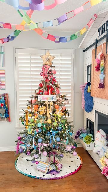 Tina Green | TheBearAndTheFawn on Instagram: "Theo’s bedroom reveal!! 🎄🌈 A rainbow holiday room for my rainbow loving boy! I’ll share a closer look at details soon, but hope you love this as much as we do! I can’t think of a happier space for the holidays💖 Tree: @kingofchristmas Candy cane wreath: @dollartree diy inspired by @ambusheedwithboys & @opal_auktober Magical sign: @chalkdesignsbyme Rainbow garland: @pearlandjane x @kelseyklos collab Tree topper: @michaelsstores Guitar: @loogguitars Flowers: @dollartree Rainbow fabric blanket : @joann_stores Velvet ribbon: @etsy and @anthropologie Stockings: @target last year #rainbowchristmas #colorfulchristmas #christmasinspiration #holidaydecor #kidsholiday #rainbow #colorfuldecor" Rainbow Baby Christmas Tree, Rainbow Tree Decorations, Rainbow Christmas Tree Ornaments, Pastel Rainbow Christmas, Kids Christmas Tree In Room, Rainbow Ornaments Diy, Rainbow Christmas Tree Ideas, Rainbow Christmas Tree Decorations, Rainbow Christmas Decor