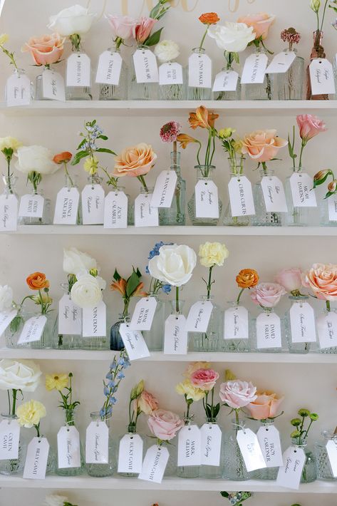 A fun yet simple idea for name tags or place holders at your tables. Wedding Place Card Display Ideas, Wedding Flower Name, Name Tag For Wedding, Wildflower Wedding Details, Bud Vase Name Card, Summer Wedding Place Settings, Unique Wedding Seating Charts, Garden Party Seating Chart, Name Tag Wedding Table