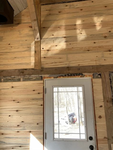 Cabin interior walls, exterior siding, and a very blue pond • The Vanderveen House Interior Pine Walls, T1 11 Siding Interior Walls Painted, Cabin Interior Wall Ideas, Blue Pine Walls, Car Siding Walls, Siding Interior Walls, Cabin Wall Ideas, Cabin Wall Colors, Cabin Fireplace Ideas