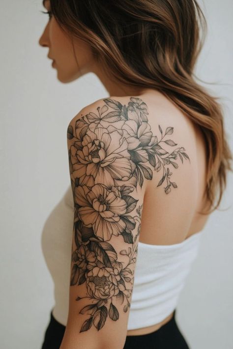 Flowers Over Shoulder Tattoo, Different Flower Tattoos Half Sleeves, Floral Tattoo Design Upper Arm, Black Floral Shoulder Tattoo, Partial Sleeve Tattoo Women Shoulder, Over The Shoulder Floral Tattoo, Flower Tattoo Over Shoulder, Flower Sleeve Tattoo Designs, Peony Tattoo On Shoulder