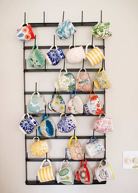 Cute ideas to organize coffee cups at your coffee bar!  ~Deborah. This blogger's coffee cup collection doubles as colorful wall art, punching up a plain wall in her mostly-neutral space. See more at Baked Brie » Hanging Mugs, Mug Storage, Mug Display, House Of Turquoise, Mug Rack, Diy Coffee, Colorful Wall Art, Kitchen Wall Decor, Organization Hacks