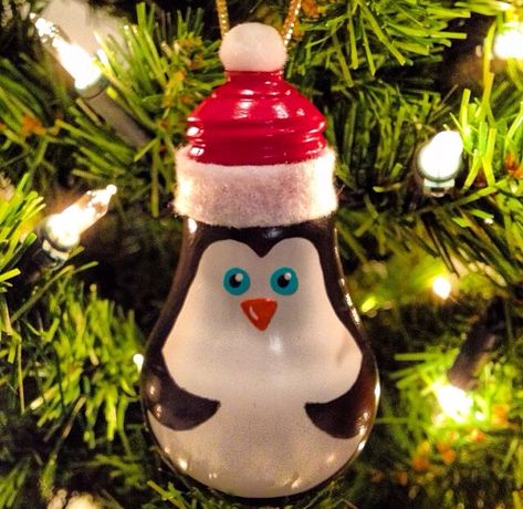 Painted lightbulb penguin ornament Painted Lightbulbs, Lightbulb Ornaments, Diy Penguin Ornament, Christmas Tree Ornament Crafts, Penguin Christmas Ornaments, Light Bulb Crafts, Wooden Christmas Tree Decorations, Christmas Diy Wood, Snowman Crafts Diy