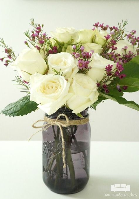 Sponsored. How to make DIY mason jar flower arrangements. These simple tried-and-true tricks will help you create lovely floral arrangements at home. Small Floral Arrangements Diy, Purple Couches, Jar Flower Arrangements, Mason Jar Flower Arrangements, Diy Hanging Shelves, Floral Diy, Mason Jar Flowers, Flowers Centerpieces, Arrangement Floral