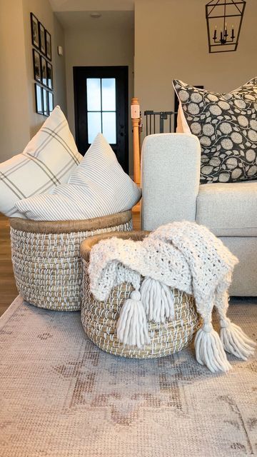 Logan Maggio | Home Decor Inspo + DIY on Instagram: "A simple way to create a cozy space is adding large baskets with pillows and throws. This set is from @305decoliving and I’m obsessed 🙌🏼 Follow my home journey on Instagram @JustAnotherWhiteHouse Curious where something is from? You can find links to my home on the free LTK app! Follow @JustAnotherWhiteHouse for exclusive app only content 🤍 #livingroom #livingroomdecor #cozy #cozydecor #cozyhome #cozyhomes #cozylivingroom #livingroominspira Living Room Throw Basket, Throw Baskets Living Rooms, Basket With Blankets Living Rooms, Large Basket Decor Ideas, Blanket Storage Living Room, Woven Basket Decor, Large Living Room Layout, Living Room Baskets, Living Room Throws