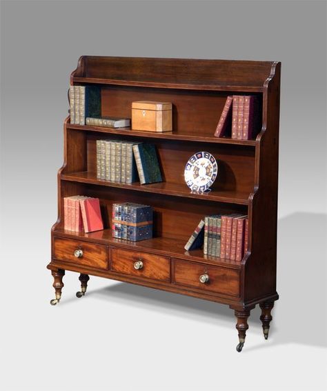 Regency mahogany waterfall bookcase. Three moulded shelves over three beaded drawers fitted with brass knobs. Raised on turned feet capped with brass castors. circa. 1825 £2,650 http://www.thakehamfurniture.co.uk/recent-acquisitions/now-in/antique-waterfall-bookcase-20-58-refno-2687/: Chinoiserie Bookshelf, Werewolf House, Waterfall Bookcase, Regency Furniture, Antique Bookcase, Georgian Furniture, Vintage Bookcase, Small Bookcase, Furniture Manufacturing