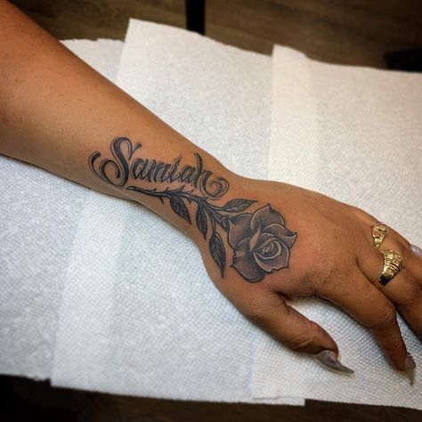 Flower Hand Tattoo With Name, Name Tattoos For Girlfriend, Tatoos Woman Hand Name, Tattoo With Moms Name, Word Sleeve Tattoos For Women, Tattoos For Memorial Black People, Forearm Name Tattoo Women, Arm Hand Tattoo Women, Significant Other Tattoos Names