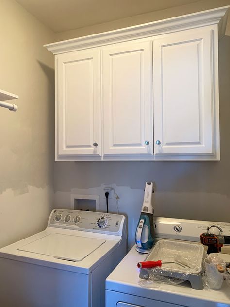 Cabinets In Small Laundry Room, Laundry Room Shelf Over Washer And Dryer Top Loader, Diy Small Laundry Room Ideas Top Loader, Small Laundry Room Shiplap, Painting Cabinets In Laundry Room, Batton Board Laundry Room, Laundry Room Chair Rail, Laundry Room With Wood Paneling, Laundry Room Ideas Beadboard