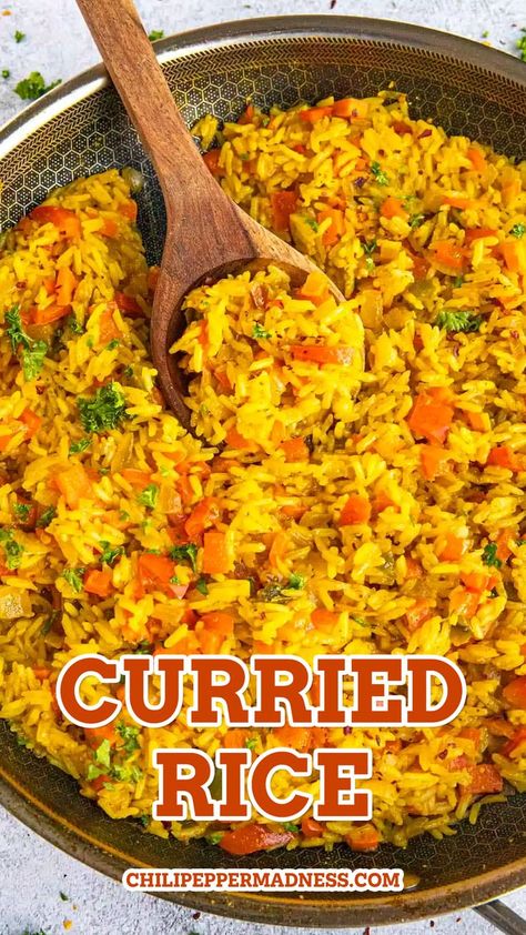 Curried Rice in a pan with a wooden spoon inside. Spicy Curry Recipes, Curry Rice Recipes, Curried Rice, Rice Dishes Recipes, Air Fryer Fish Recipes, Satay Recipe, Chili Pepper Recipes, Rice Side Dish Recipes, Spicy Curry