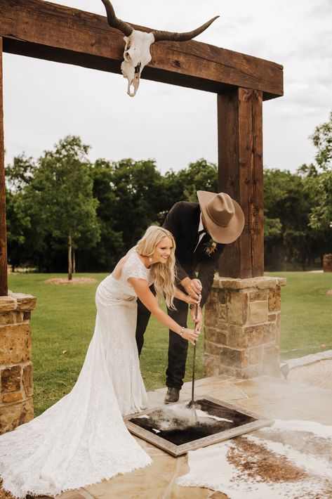 Western Wedding |  Cowboy Wedding | Texas Wedding Photographer | Boho Wedding | Madi Wagner Photography Boho Archway Wedding, Country Honeymoon Ideas, Wedding Dresses That Look Good With Cowboy Boots, Western Isle Runner, Branding A Cowhide Rug Wedding, Cow Hide Branding At Wedding, Wedding Branding Ceremony Cowhide, Western Wedding Altar, Rustic Field Wedding