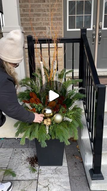 Vanessa Monardo on Instagram: "When creating a planter to add interest all winter, I like to focus on TEXTURE!   Incorporate greens like boxwood, Sapphire and Oregonia with your cedars and pines to really add character and lasting drama.   This neutral winter planter is perfect for taking your home through the winter months!" Outdoor Christmas Baskets, Christmas Door Planters, Christmas Porch Topiaries, Front Door Christmas Planter Ideas, Christmas Front Door Planters, Front Door Planters Winter, Potted Christmas Decor, Decorating Planters For Christmas, Christmas Pot Decorations Outdoor