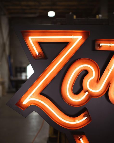 This week we installed a new neon sign for @zorchpizza at their Forest Hill location. Complete with custom copper plated channel letters, LED backer and single stoke neon lettering, it’s a perfect addition to their new location. #neon #customsigns #signs #vintageneon #fabrication #weld #metalfabrication Neon Wayfinding, Copper Signage, Neon Writing, Neon Lettering, Blade Sign, Flying Squirrels, Neon Letters, Cool Signs, Give Me A Sign