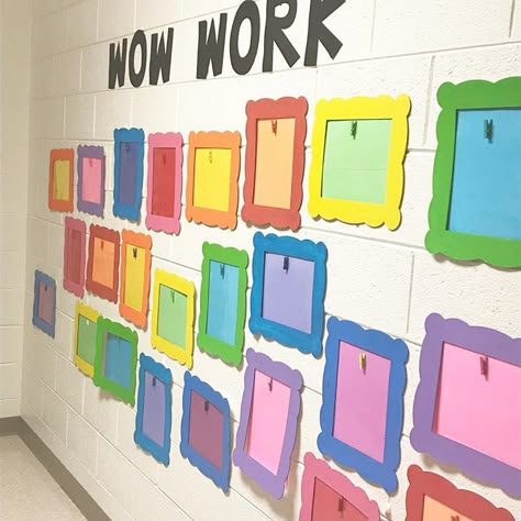 KinderKids on Instagram: “The wall is ready for a new batch or work this year!” Primary Color Bulletin Board, Daycare Art Wall Ideas, Classroom Photo Wall Bulletin Boards, Art Wall Ideas Classroom, Art Wall Classroom Display, Art Wall Preschool Classroom, Kindergarten Board Ideas, Teacher Wall Decor, Classroom Photo Wall