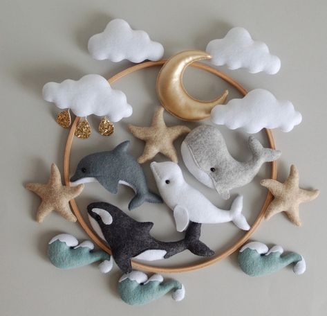 🐋 Baby handmade mobile for boys. The orca mobile with dolphin, beluga, whale, ocean waves and stars.  Wonderful present for the first birthday of your son or even make the ideal baby shower gift. Individual design is possible. Just ask me if you want to change any detail of the mobile for free.  📏 The size.  The diameter of the ring is 25 cm (10 inches). Full length ~ 50 cm (~20 inches). Weight ~ 150 grams 🐋 Different colors are possible. 🐋 Materials Beech ring, half-woolen felt (America, Sp Ocean Felt Mobile, Crib Newborn, Hanging Crib Mobile, Whale Mobile, Hanging Crib, Seashell Christmas, Baby Mobile Felt, Whale Nursery, Baby Boy Mobile