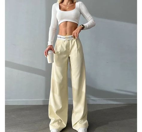 23.87 - USE CODE MAINE23 FOR A DISCOUNT! Hitting the sweet spot between streetwear and formal dressing, these wide-leg pants are designed with a fold-over waistband punctuated with a contrast color and lettering print. The high waist pants with a flowy silhouette would pair well with a skintight crop top. 2023 Jeans, Celana Fashion, Casual Work Pants, Work Pants Women, Casual Cargo Pants, Waistband Pants, Loose Trousers, Leg Work, Jeans Cargo