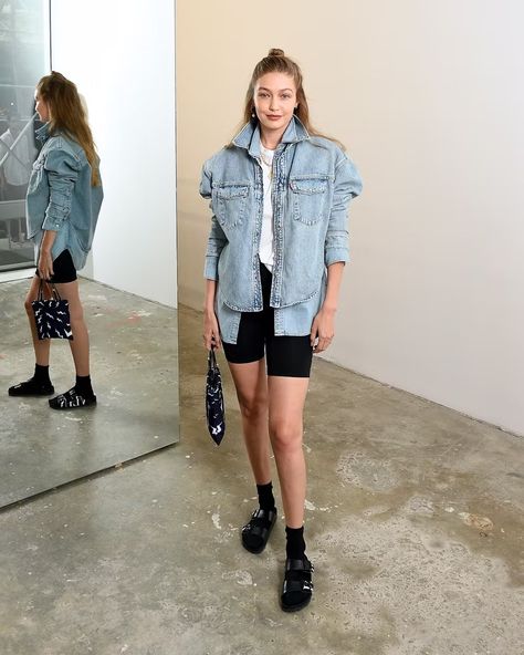 Leave it to the eldest Hadid for a simple yet impactful take on Birkenstocks that's worth recreating. Start with your go-to basic biker shorts, a white tee, and a pair of athletic socks. Then layer a boxy denim jacket over a chambray button-down and, voilà, a supermodel-approved outfit. Hadid’s favorite pair of shoes are from the Valentino x Birkenstock collab Look Bermuda, Zayn And Gigi, Gigi Hadid Fashion, Gigi Hadid Hot, Sandals With Socks, Athleisure Essentials, Bike Shorts Outfit, Gigi Hadid Looks, Hadid Fashion