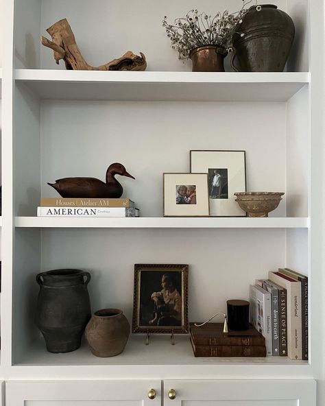 Shelf styling ideas Shelfie Follow my shop @katewinfordhome on the @shop.LTK app to shop this post and get my exclusive app-only content! #liketkit #LTKSeasonal #LTKstyletip #LTKhome @shop.ltk https://liketk.it/4LObg #shelfie #shelfstyling #interiordesign Small Space Shelf Ideas, Simple Shelving Decor, Picture Layering On Shelf, Shelving Decor Kitchen, Thrifted Shelf Styling, Entryway Decor Floating Shelf, Shelf Staging Bookcase Styling, Cb2 Shelf Styling, Low Shelf Styling