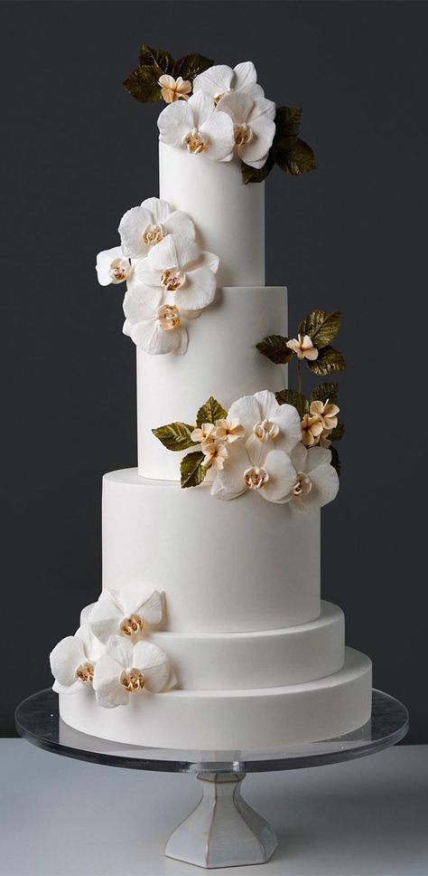 wedding cake, the most beautiful wedding cake, elegant wedding cake, wedding cake design, wedding cake inspiration, wedding cake photos, opulent wedding cake, wedding cake pictures, wedding cakes, wedding cake trends Wedding Cakes With Orchids, Blue Orchid Wedding Cake, Spiral Wedding Cake, Wedding Cake Designs Elegant White, White Orchid Wedding Cake, Simple Wedding Cake Table Ideas, Wedding Cake Designs Elegant 2024, Wedding Cakes 2024, Elegant Modern Wedding Cake