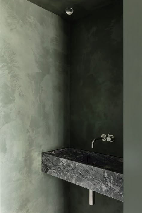 Apartment on the Belgian coast balances natural and industrial materials Dark Microcement Bathroom, Soothing Interiors, Mint Green Bathrooms, Tranquil Bathroom, Interior Minimal, Wellness Centre, House Vibes, Guest Toilet, Marble Sinks