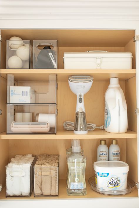 Minimal Laundry Room Organization, Laundry Cabinet Storage, Laundry Cabinet Organization Ideas, Hair Dryer And Curling Iron Storage, Bath Salt Storage Ideas, Aesthetic Laundry Organization, Laundry Ideas Organization, Laundry Room Cupboard Organization, Laundry Room Organization Modern