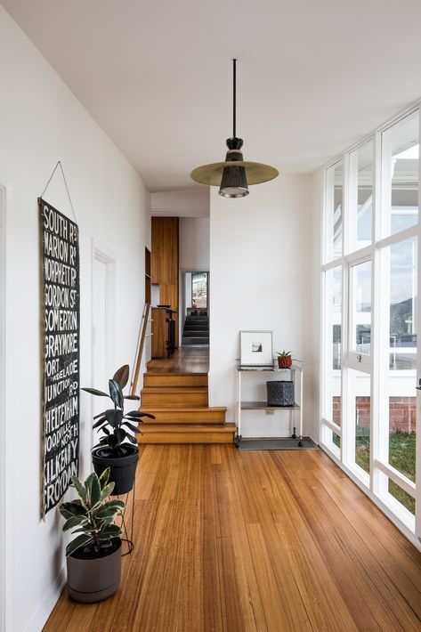 An Architect's 1958 Midcentury in Tasmania Gets a Graceful Renovation - Photo 4 of 15 - Inside the entry, which affords a view through the house towards the extension, Emery's original palette combines white walls with wood floors. Mid Century Modern Flooring, Modern Wood Floors, Wood Floor Design, Mid Century Wood, Modern Flooring, Mid Century Modern Wood, Mid Century Modern Bedroom, Midcentury Home, Mid Century Living Room